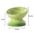 Green ceramic bowl with dimensions marked on a white background