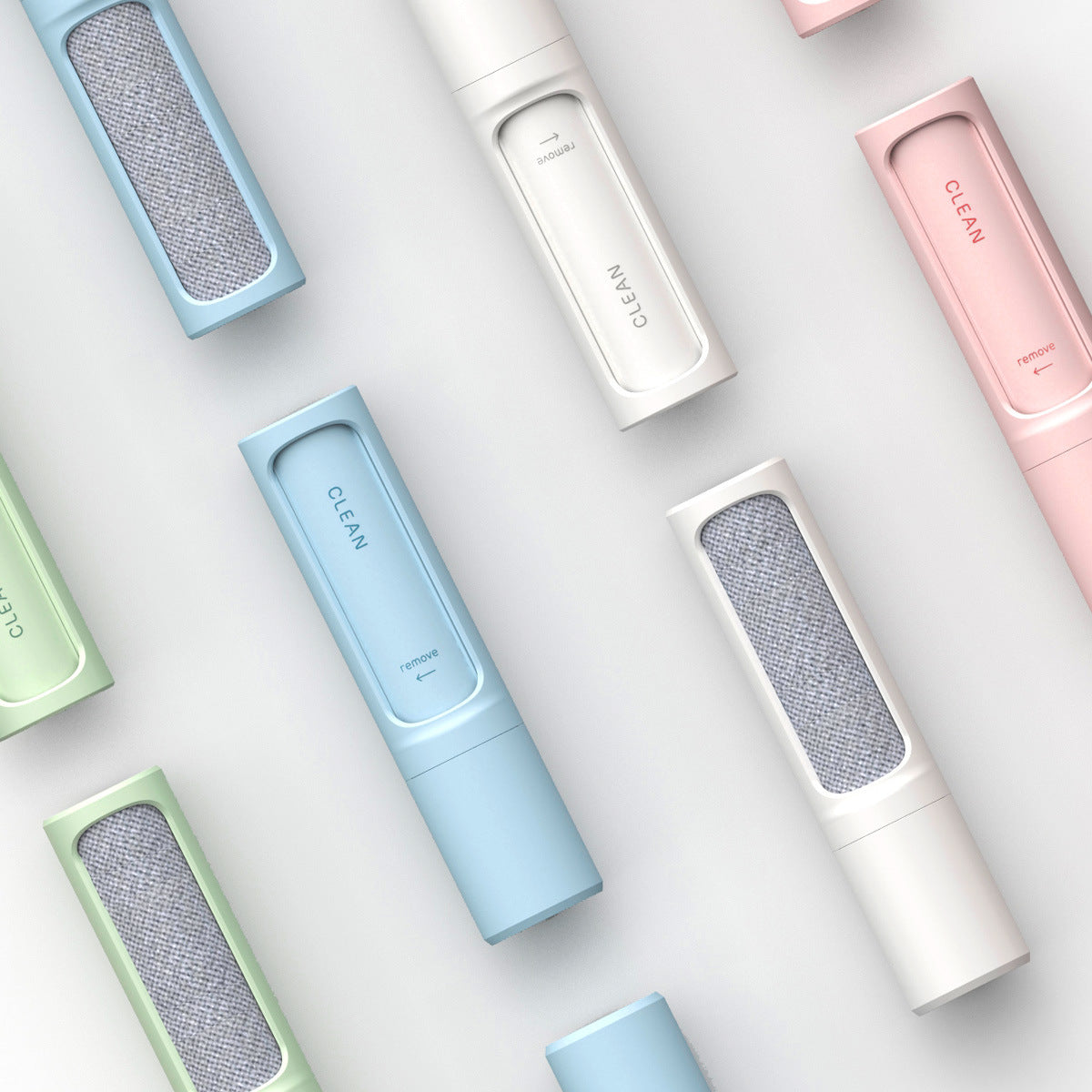 Different colored lint rollers with light background 