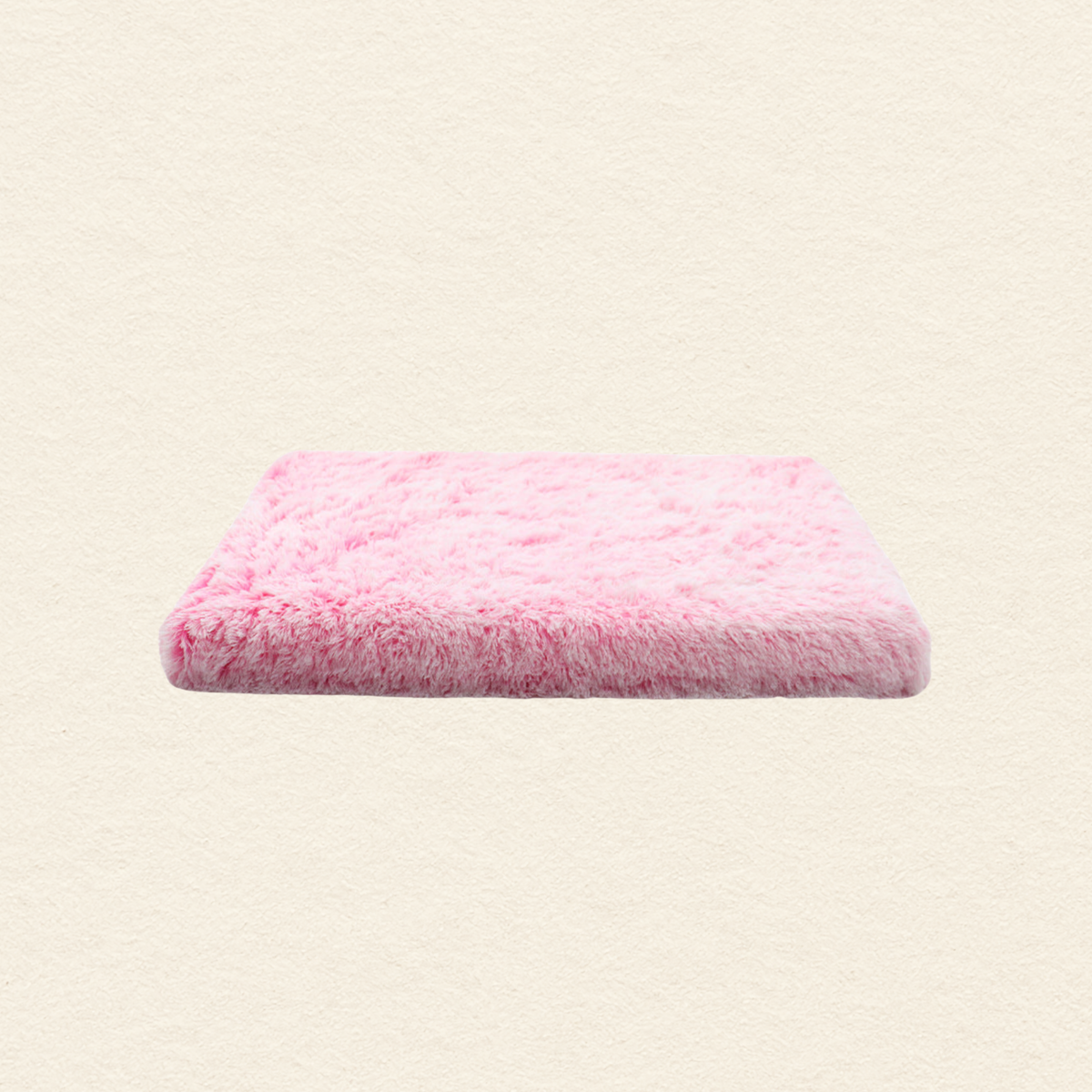 A square pink fluffy faux fur cushion or pet mat, shown floating against a textured off-white background.