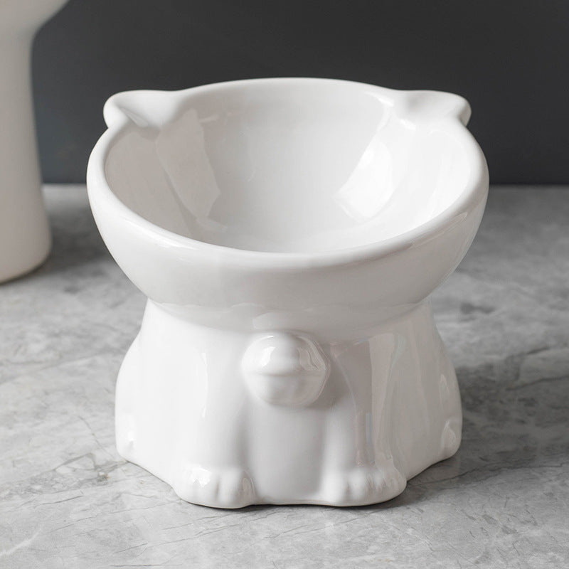 White ceramic cat-shaped bowl on a gray surface