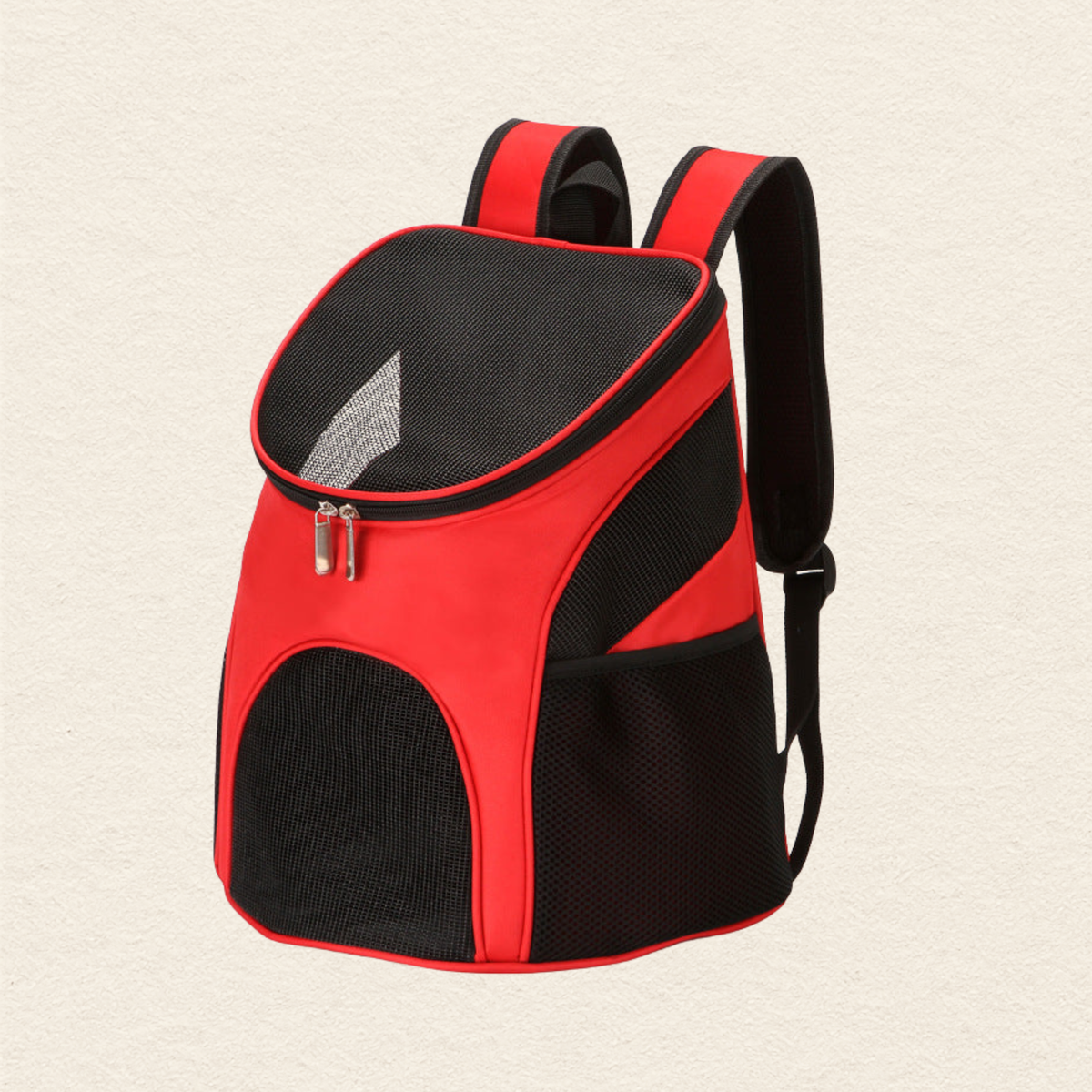 A red and black pet carrier backpack with mesh ventilation panels and padded shoulder straps, shown on a light textured background.