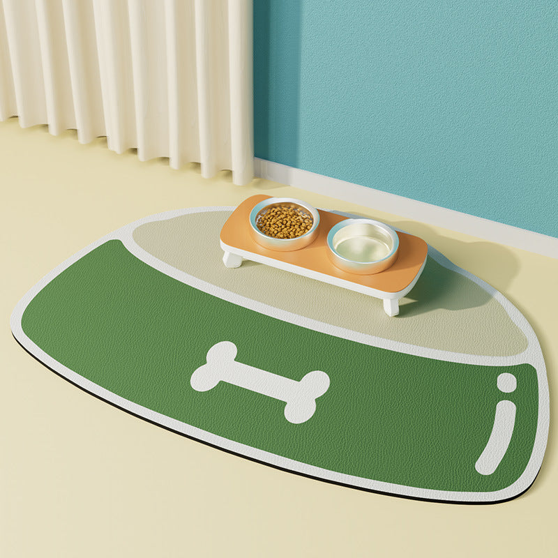 Green pet mat with a pet bowl design and a small table with bowls on a light-colored floor.